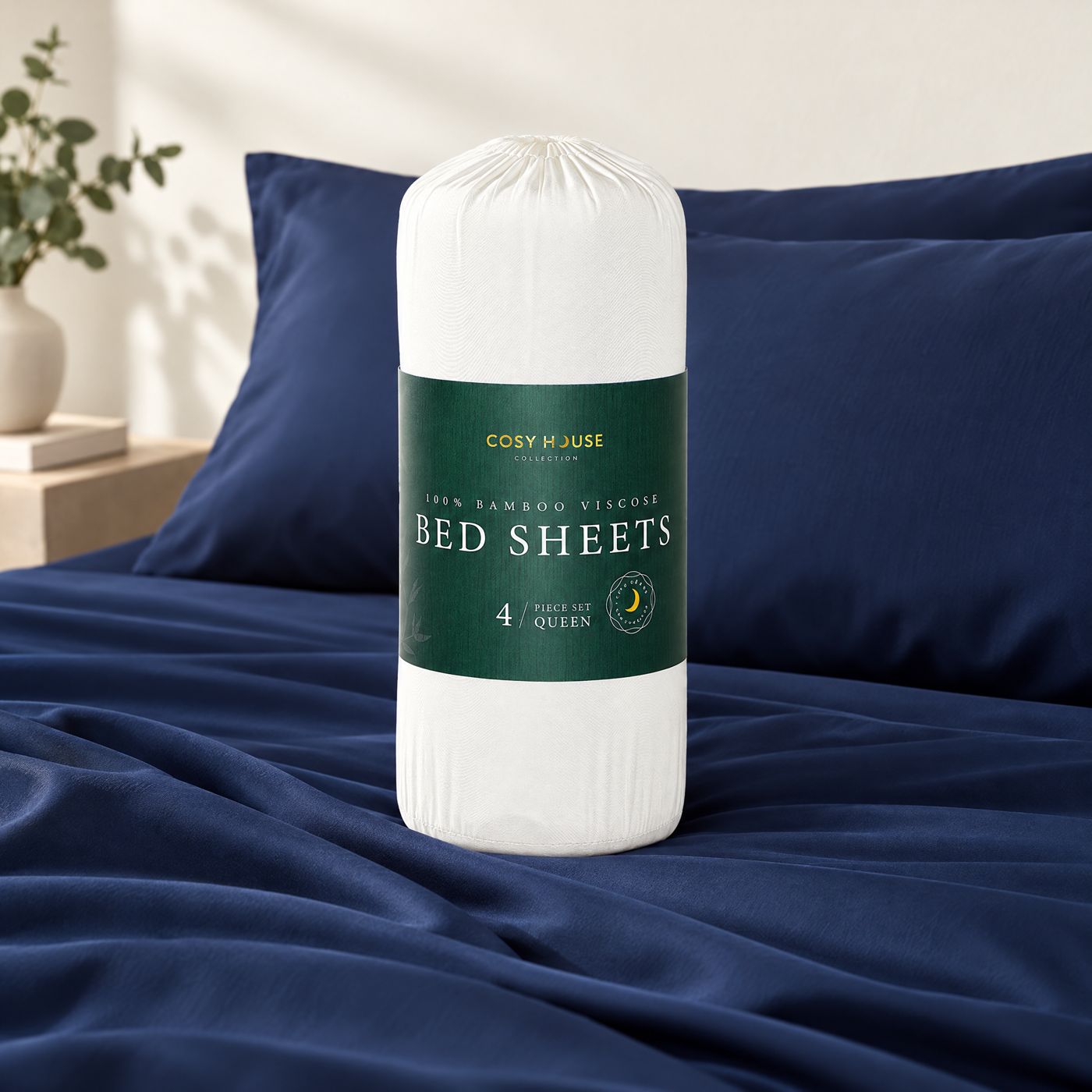 Cosy House 100% Bamboo Viscose Bed Sheets in their packaging on a navy bed
